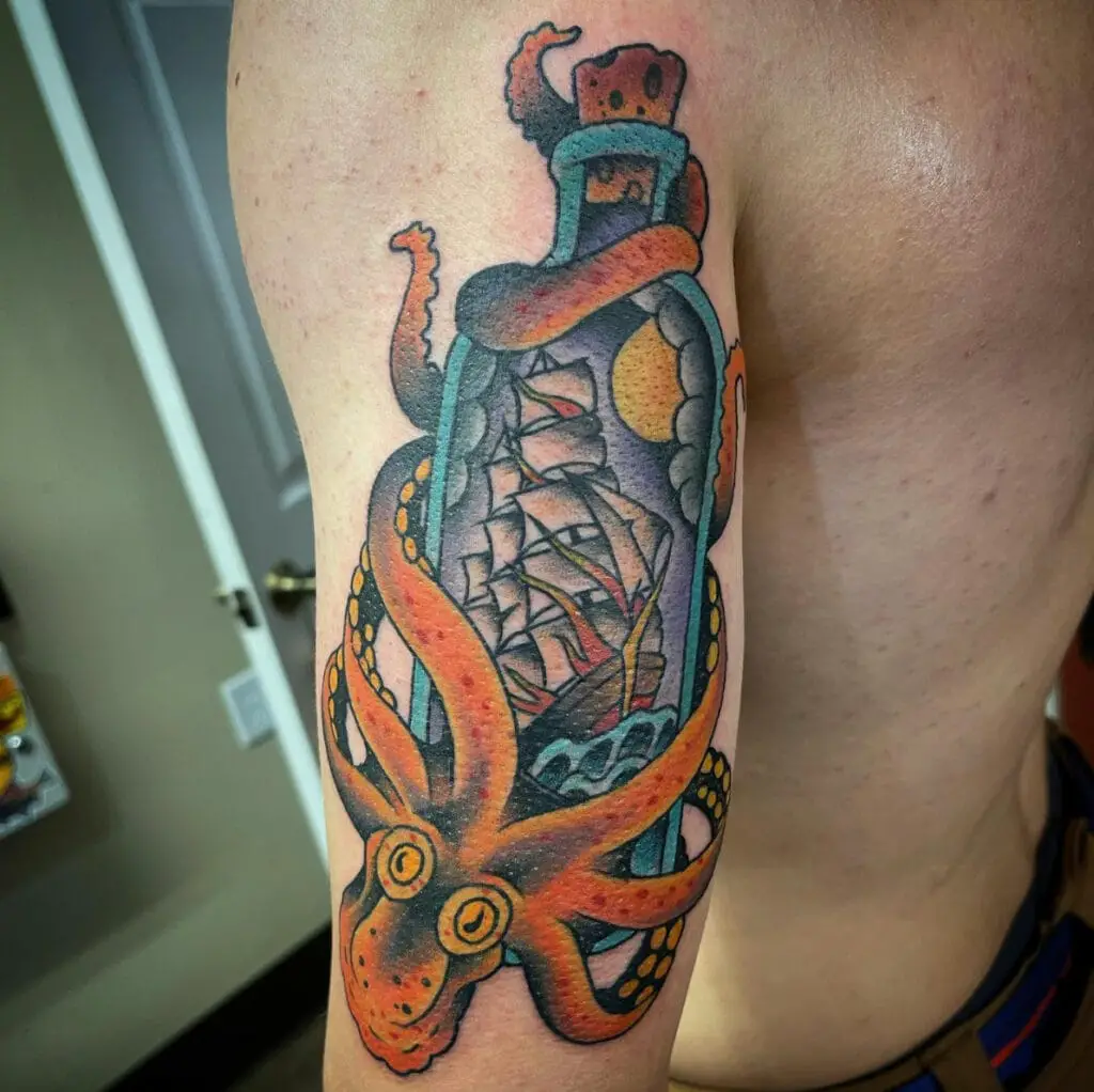 Colored Giant Octopus Holding the Ship in Bottle Upper Arm Tattoo