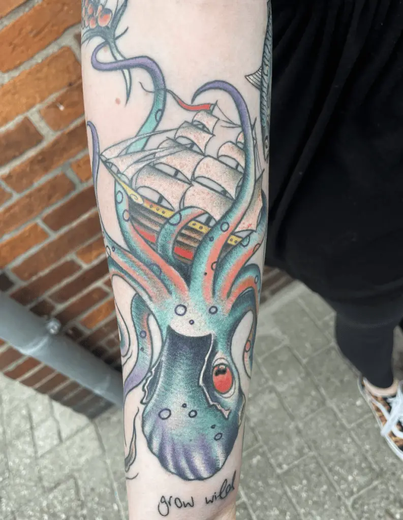 Colored Kraken Holding the Battle Ship Arm Tattoo