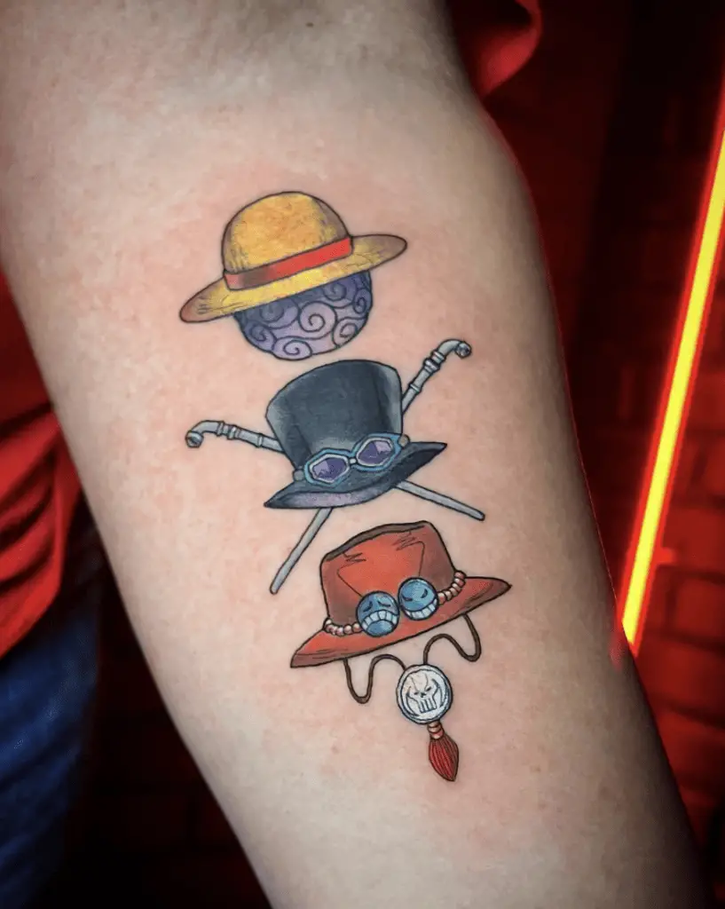 Colored Luffy, Sabo and Ace Hats Aligned Vertically Arm Tattoo
