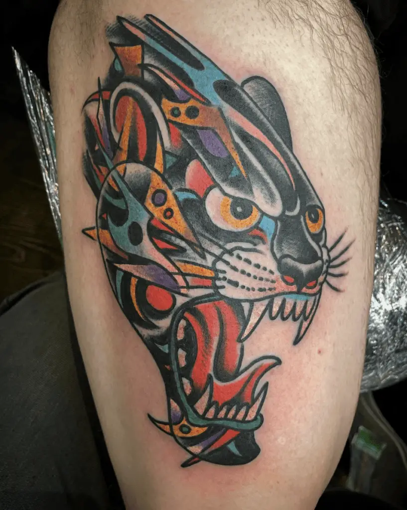 Colorful Black Panther Head With Tribal Design Thigh Tattoo