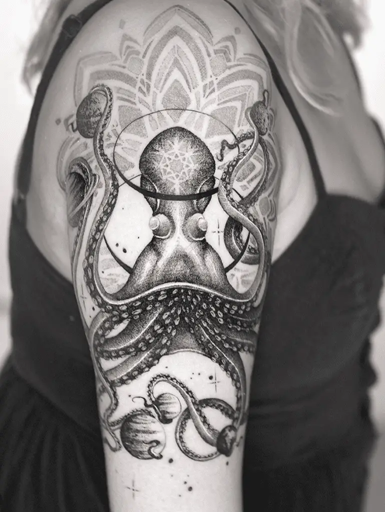 Detailed Celestial Octopus With Mandala Flower Background Upper Arm Tattoo