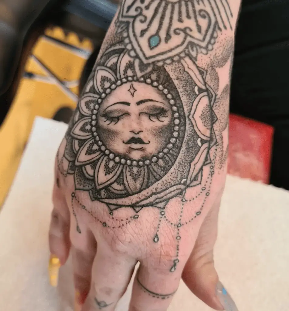 Detailed Ornamental Sleeping Sun and Crescent Moon Hand Tattoo
