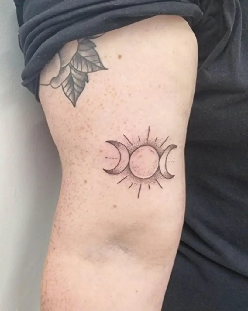 Dot Work Lunar Eclipse Upper Arm Tattoo
