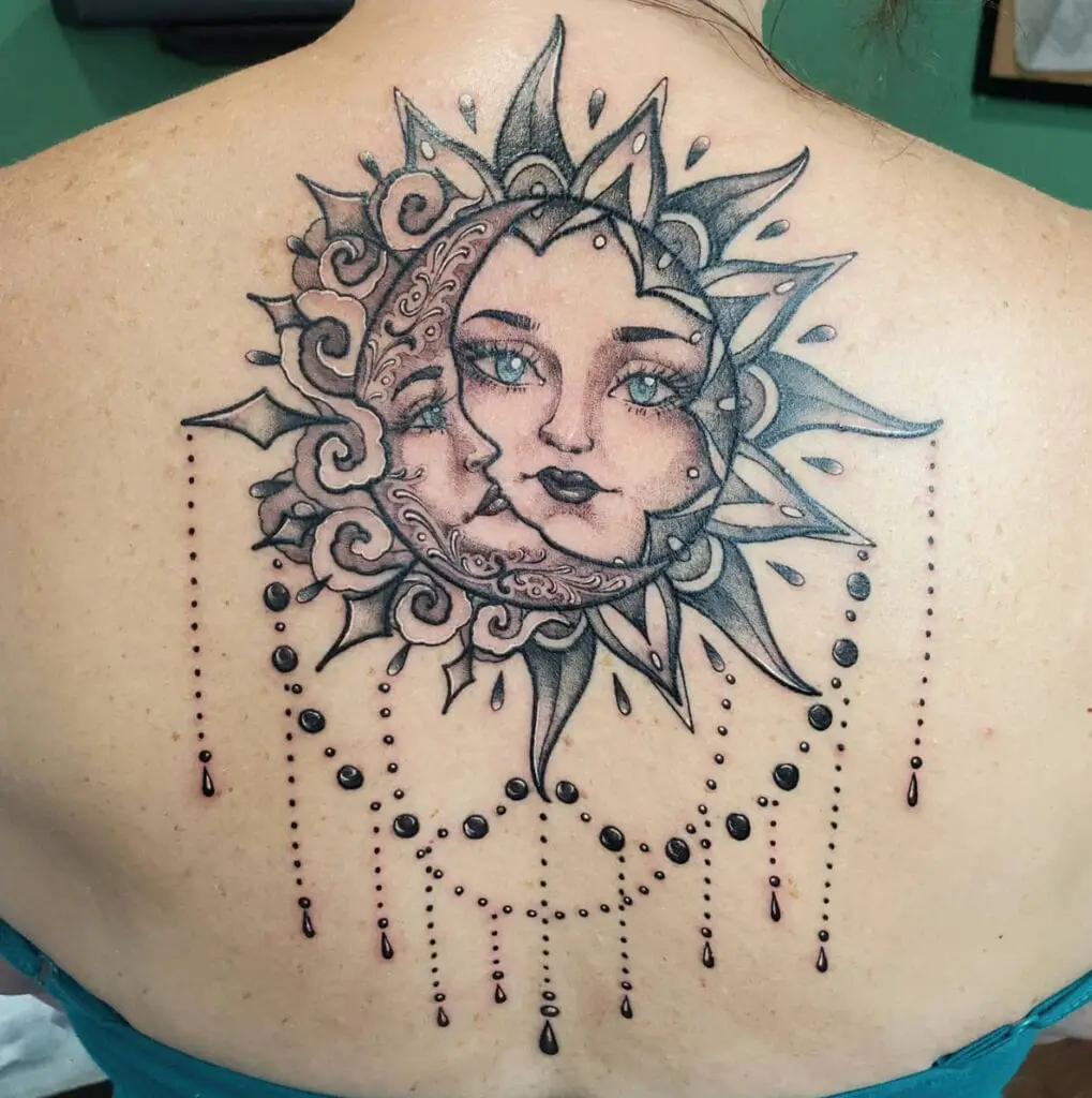 Elegant Sun and Moon Faces With Embellishments Back Tattoo
