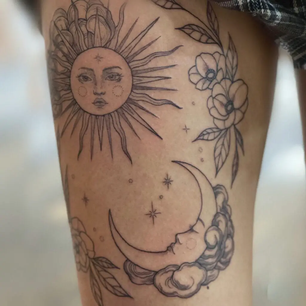 Feminine Sun and Sleeping Crescent Moon With Stars and Flowers Thigh Tattoo