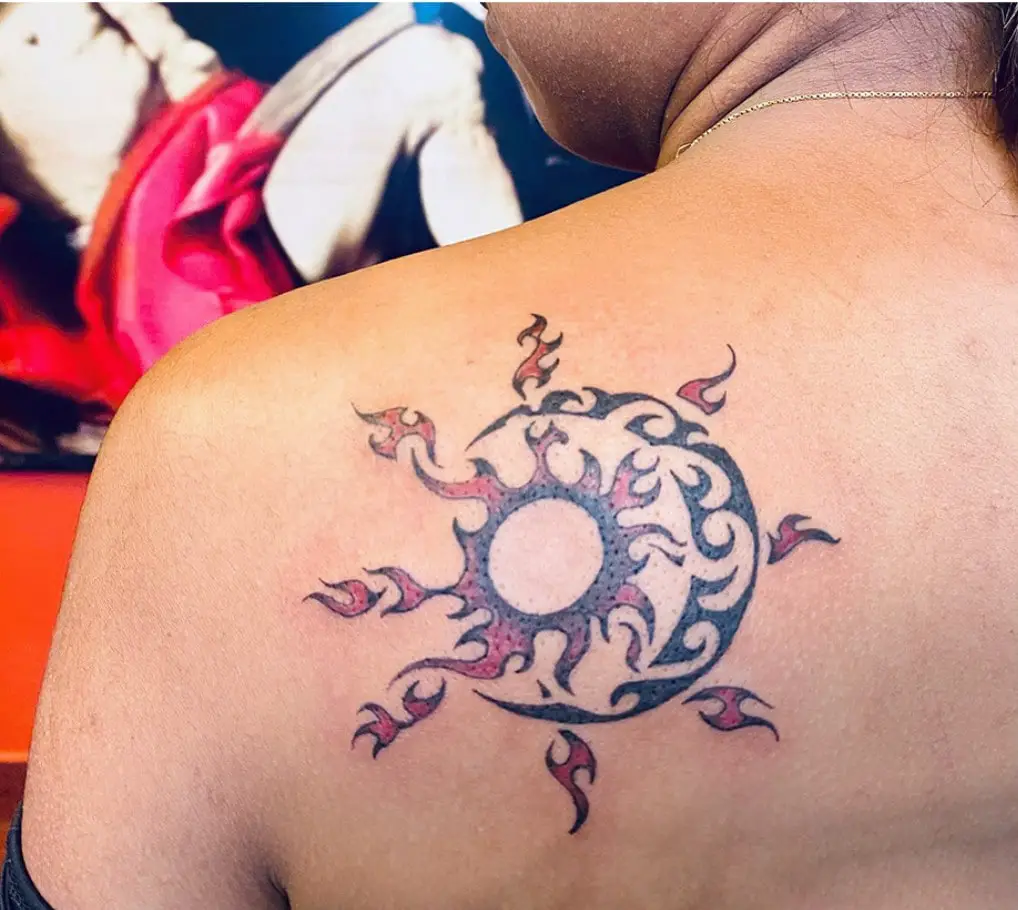 Fiery Tribal Sun and Moon Back Tattoo