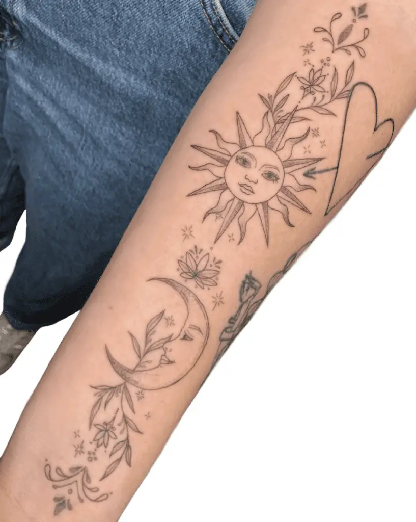 Fine Line Floral Sun and Moon Surrounded By Stars Vertically Aligned Arm Tattoo