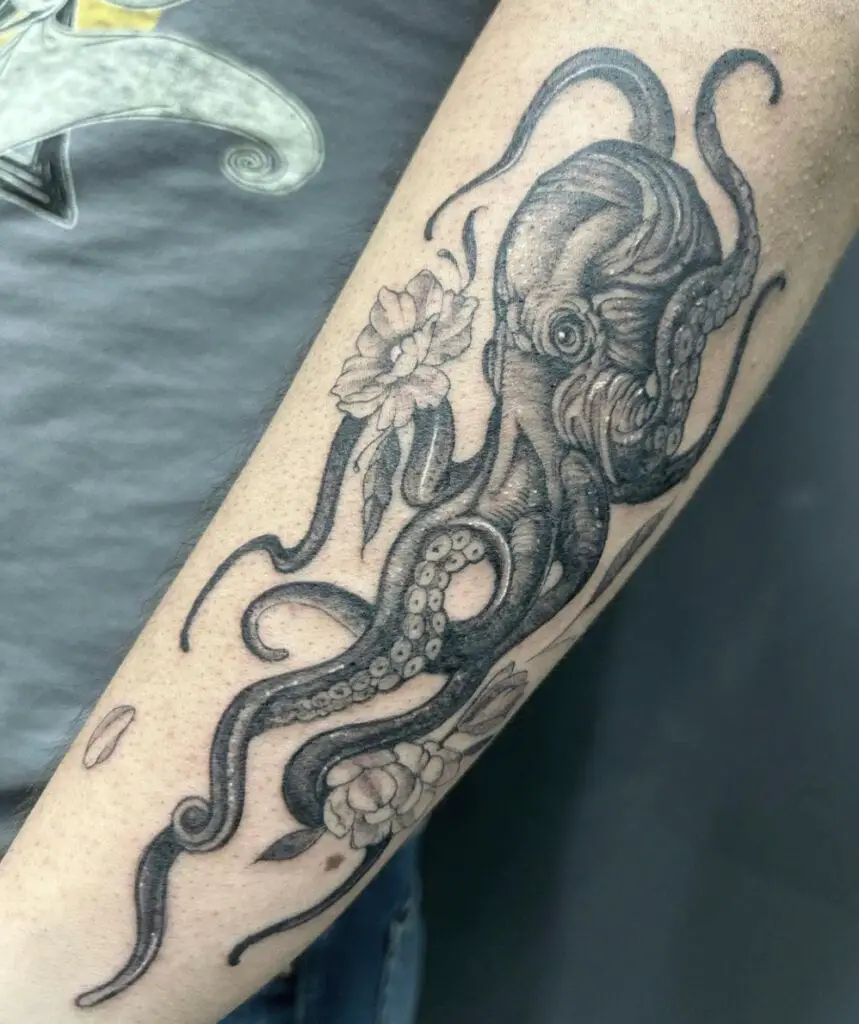 Giant Octopus With Flowers Arm Tattoo