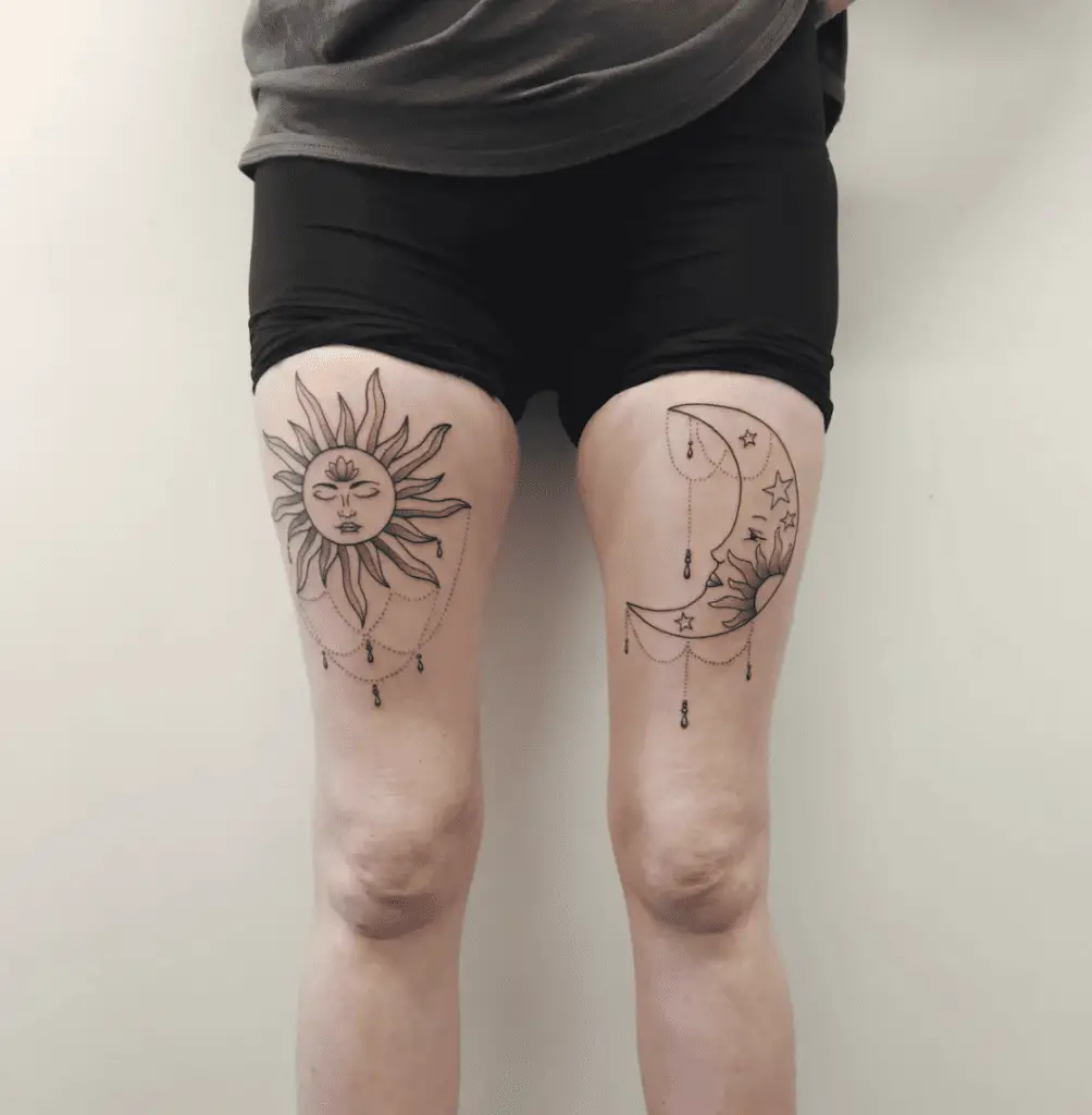 Line Work Sun and Crescent Moon With Hanging Embellishments Thigh Tattoo