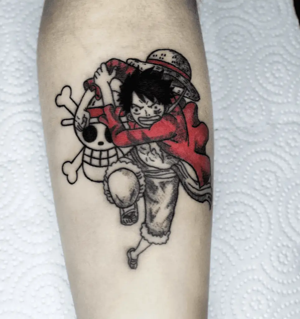 Luffy Running and Throwing a Punch in Front of the Straw Hat Pirate Skul Arm Tattoo