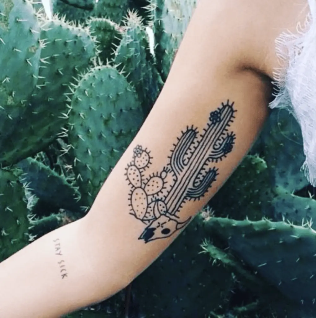 Simple Line Work Cactus and Cow Skull Arm Tattoo