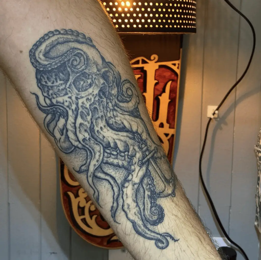 Kraken Skull With Metal Anchor Arm Tattoo
