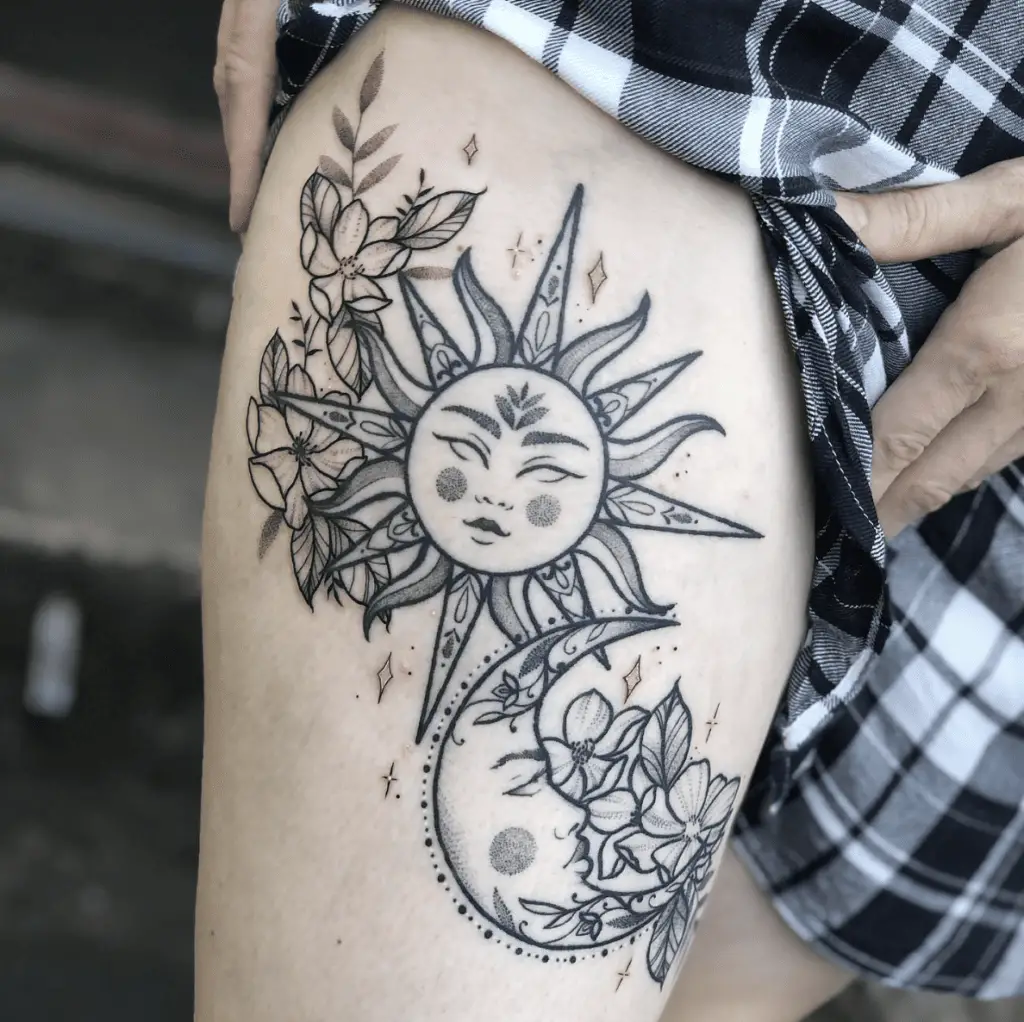 Sun and Moon With Flowers and Stars Thigh Tattoo