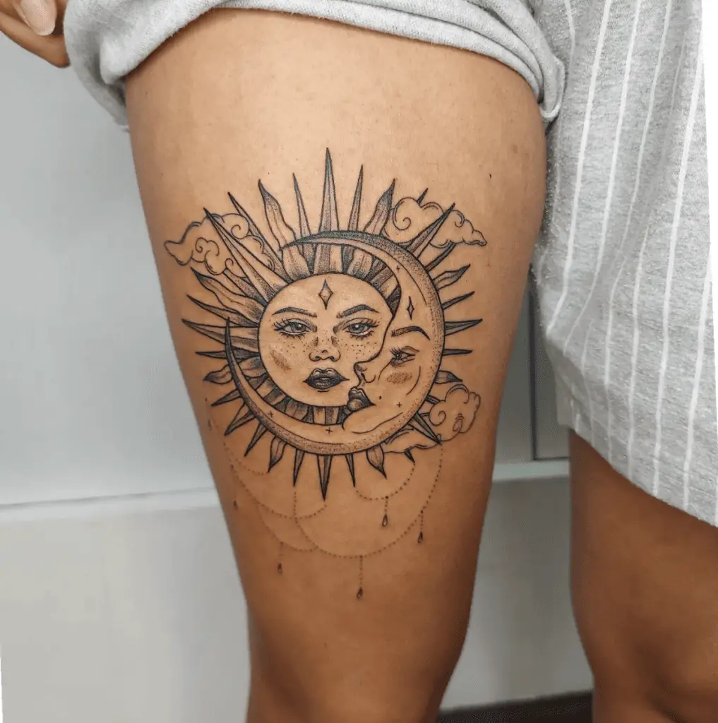 Sun and Moon With Stars and Hanging Embellishments Thigh Tattoo