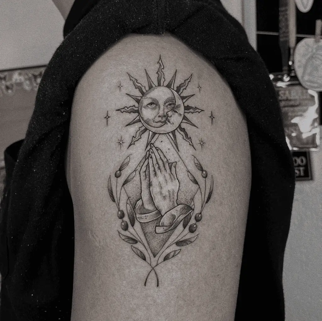 Sun and Moon With Stars and a Hand Praying Under By Leaves Strands Arm Tattoo