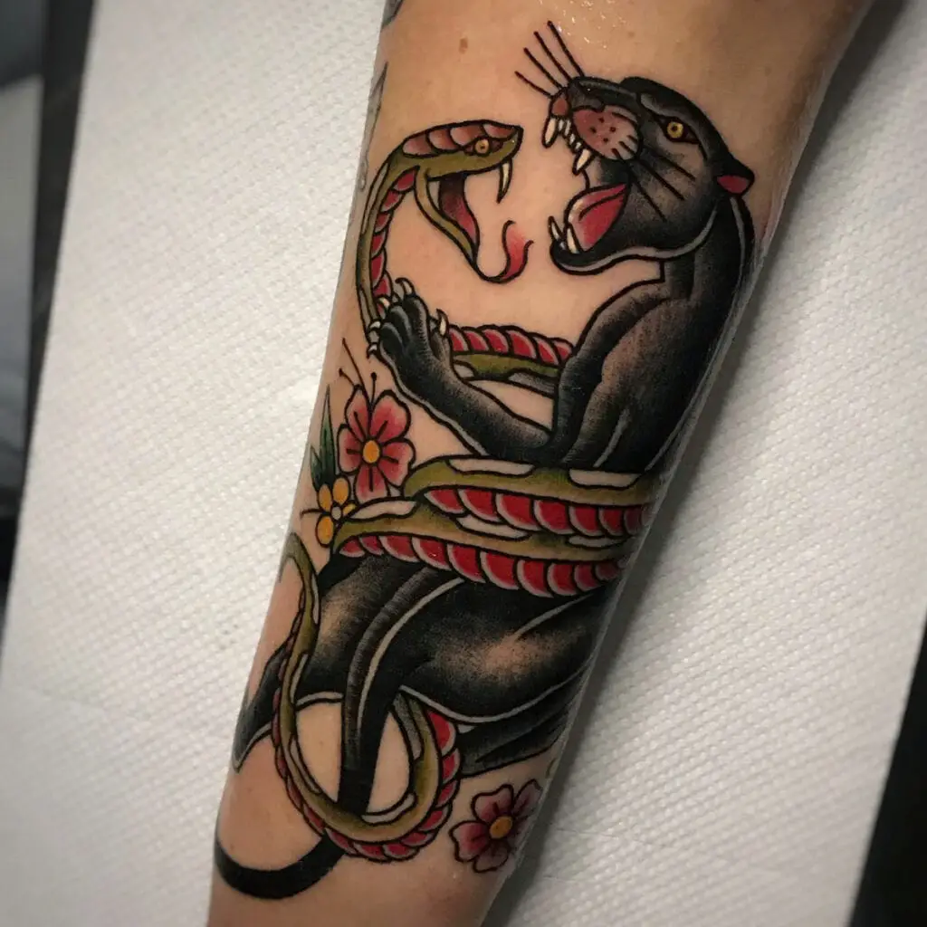 Traditional Black Panther and Snake Facing Each Other Arm Tattoo