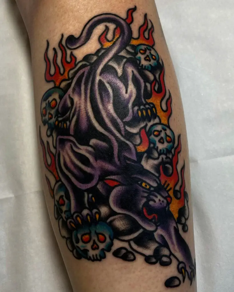 Violet Panther With Fire and Skulls Arm Tattoo