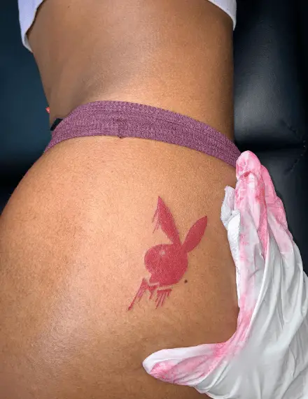 Pink Ink Dripping Playboy Bunny Tattoo