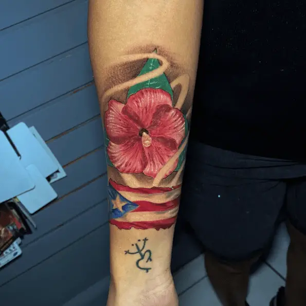 La Flor de Maga with the Island-shaped Flag Tattoo