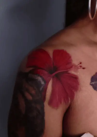 Water Colored Red Flor de Maga Shoulder Tattoo