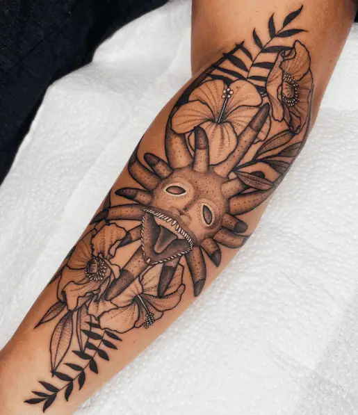 Vejigante Mask and Flowers Sleeve Tattoo