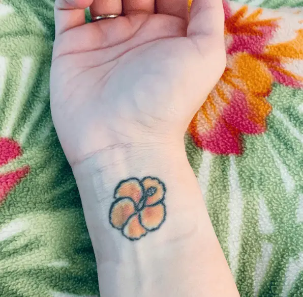 Yellow Tiny Hibiscus Flower Wrist Tattoo