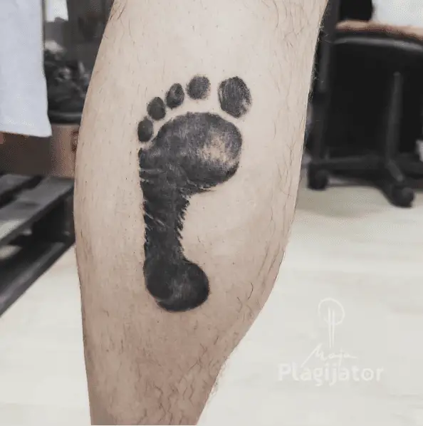 Black and Grey Baby Foot Print Calf Tattoo