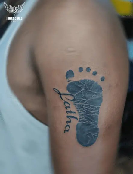 Baby Foot with Name Latha Arm Tattoo