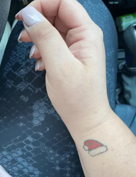 Tiny Santa Hat Wrist Tattoo