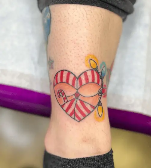 Heart Shaped Candy Cane Leg Tattoo