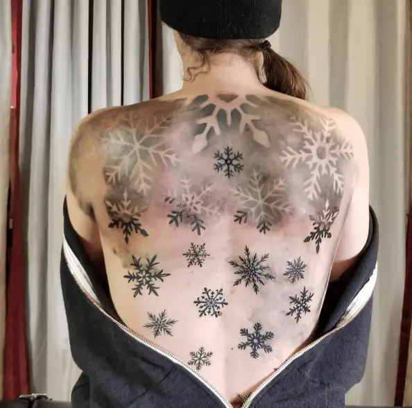 Black Ink Snowflakes Back Tattoo