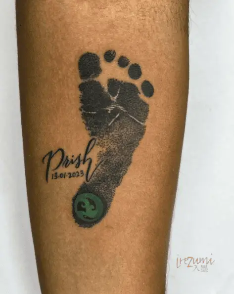 Black Ink Baby Footprint and Name with Date Tattoo