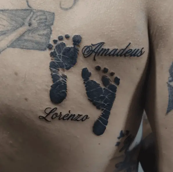 Black Ink Two Babies Footprints with Names Back Tattoo