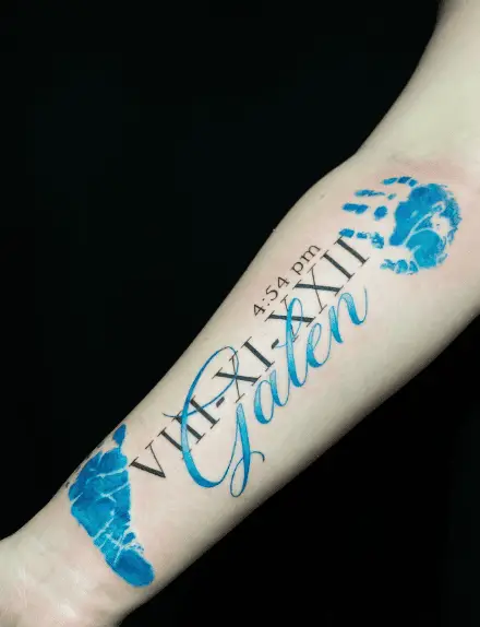 Blue Ink Baby Prints with Birth Info Forearm Tattoo