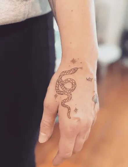 Curved Tiny Snake Hand Tattoo
