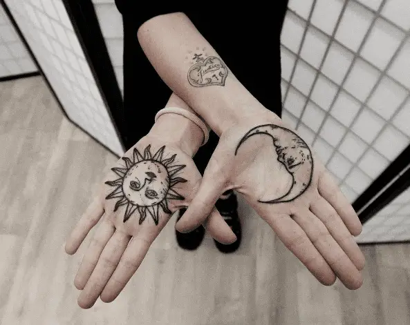 Sun and Moon Faces Palm Tattoo