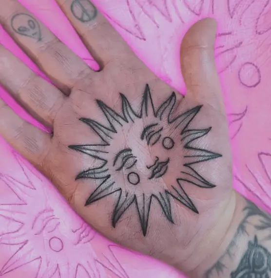 Sun Face Palm Tattoo