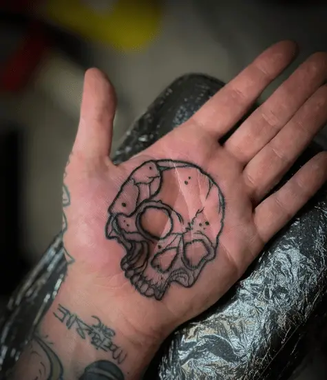 Black Line Skull Palm Tattoo