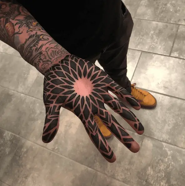 Bold Black Ink Full Palm Tattoo