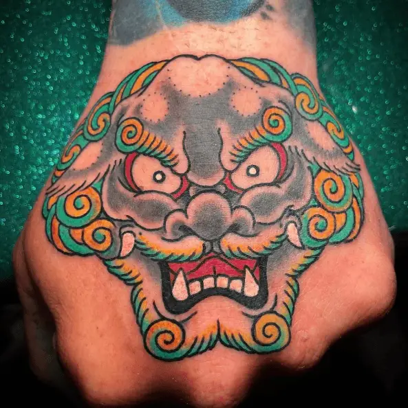 Greyscale and Colored Mix Foo Dog Hand Tattoo