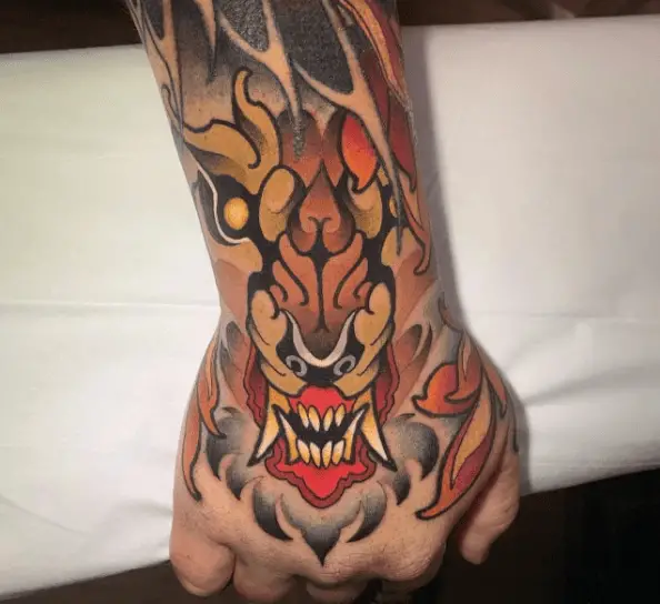 Angry Face Japanese Dragon Hand Tattoo