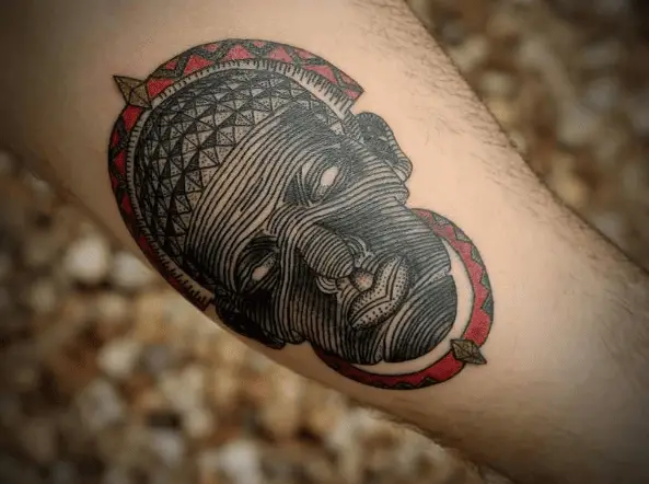 African Tribal Mask Line Tattoo