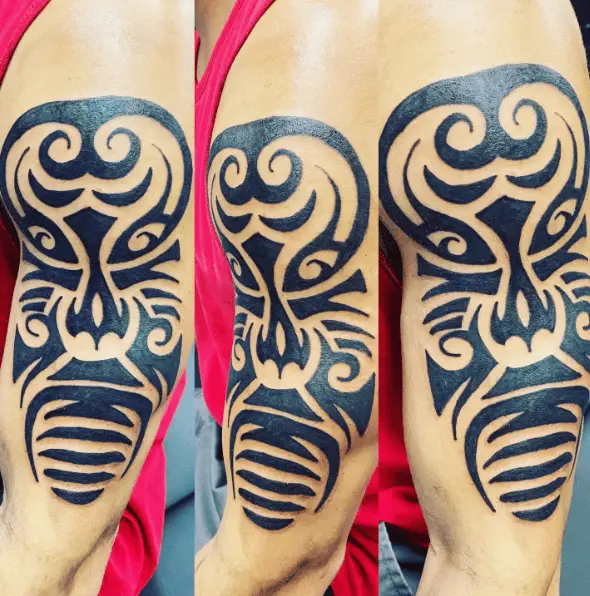 Bold Ink African Mask Arm Tattoo