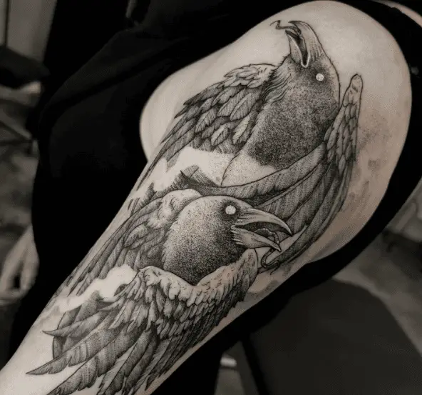 Greyish Huginn and Muninn Arm Tattoo
