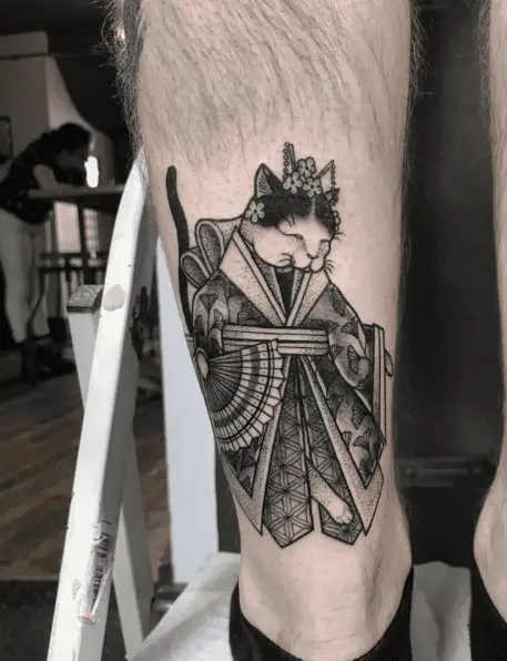 Black and Grey Japanese Cat Dressed in Kimono and Holding a Fan Tattoo