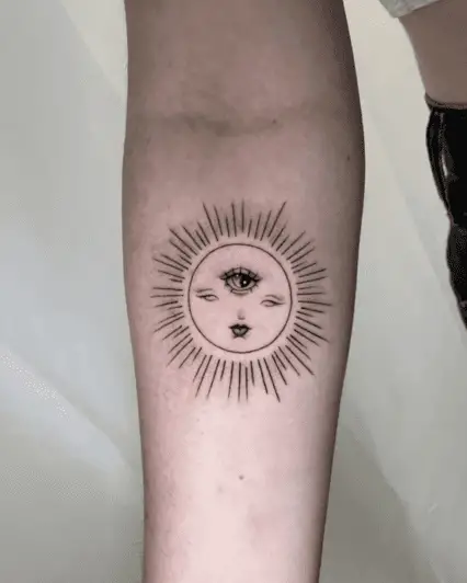 Line Work Sun With a Third Eye Arm Tattoo