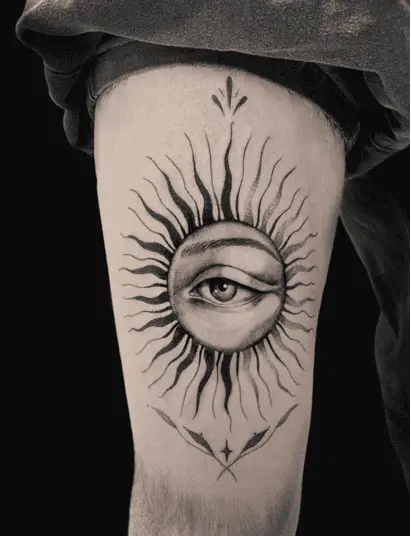 Black and Grey Wavy Sun Human Eye Thigh Tattoo