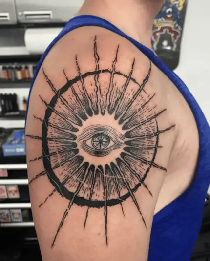 Black Work Big Eye Sun and Moon Upper Arm Tattoo
