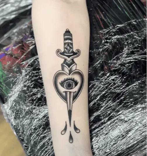 Black And Grey Eye Heart and Dagger With Droplets Arm Tattoo
