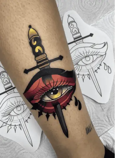 Colored Illustration of Eye Heart With Dagger Leg Tattoo